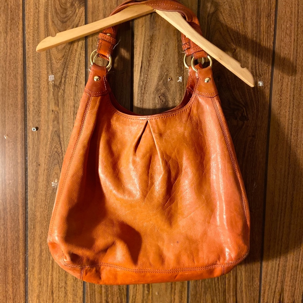 Orange leather coach shoulder bag